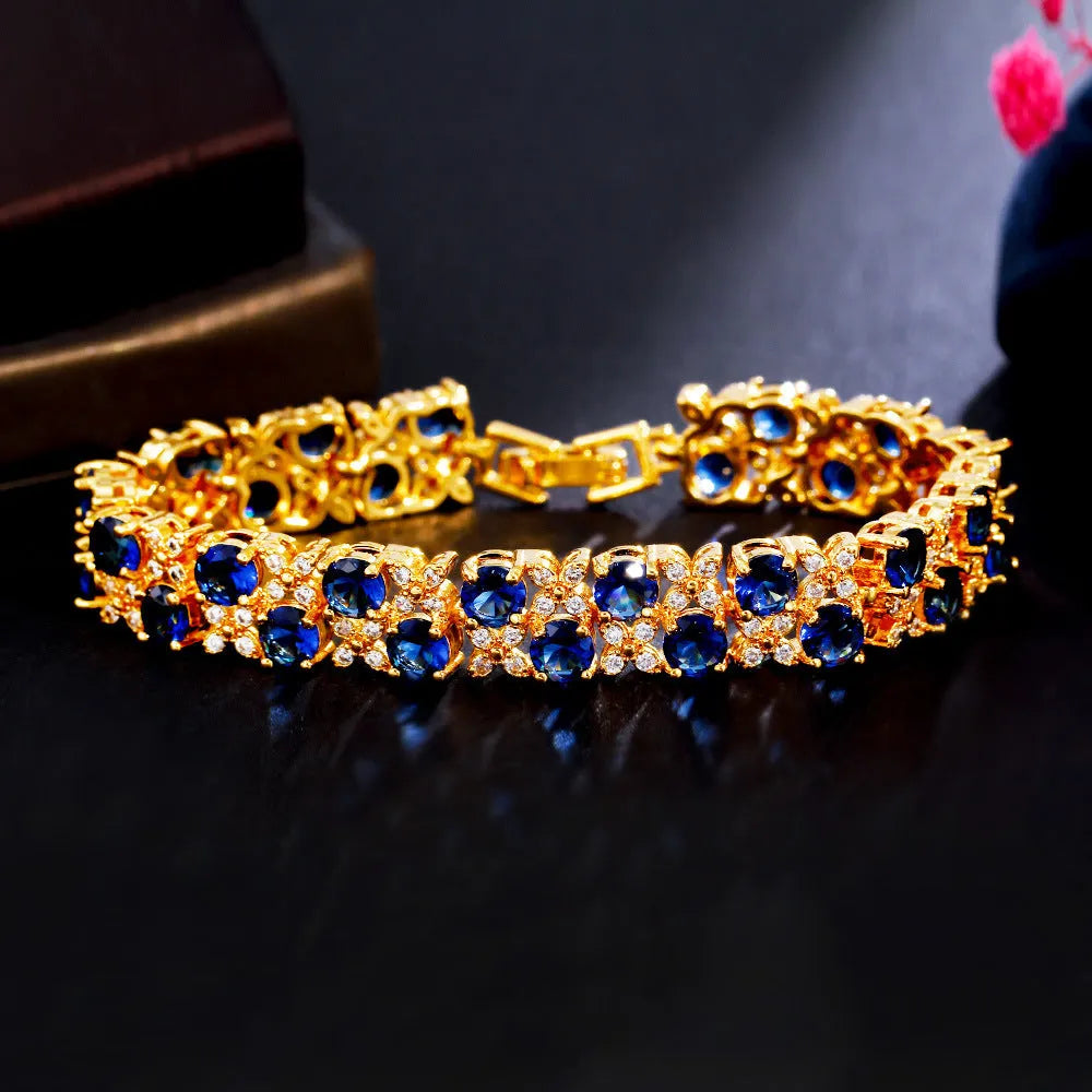 Electroplated 18K gold women's bracelet with zircon stones, crown and heart motifs, on brass chain
