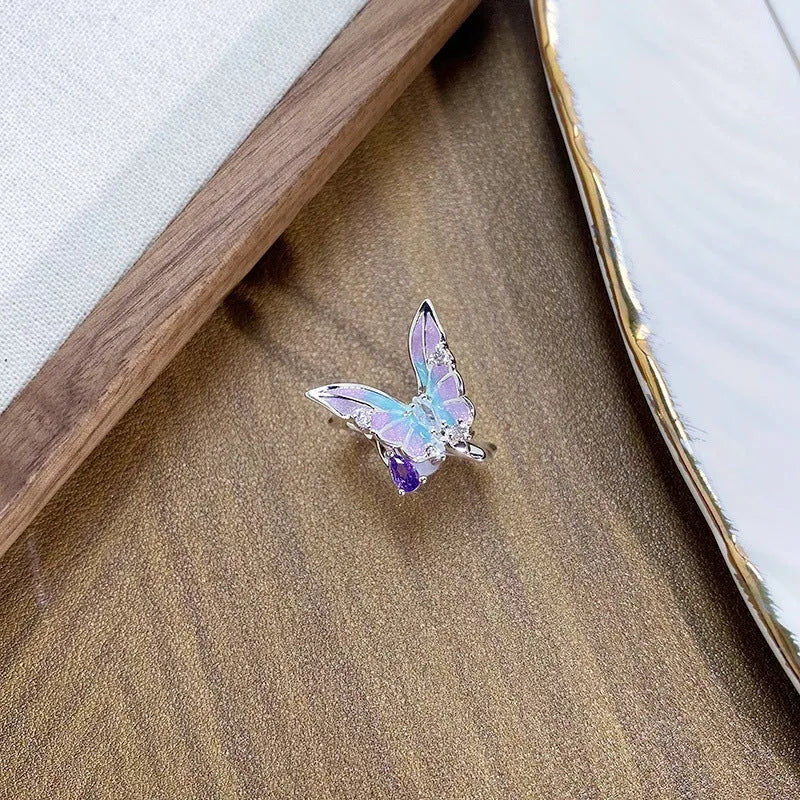 Adjustable copper insect ring with dripping oil colour finish in an irregular design.