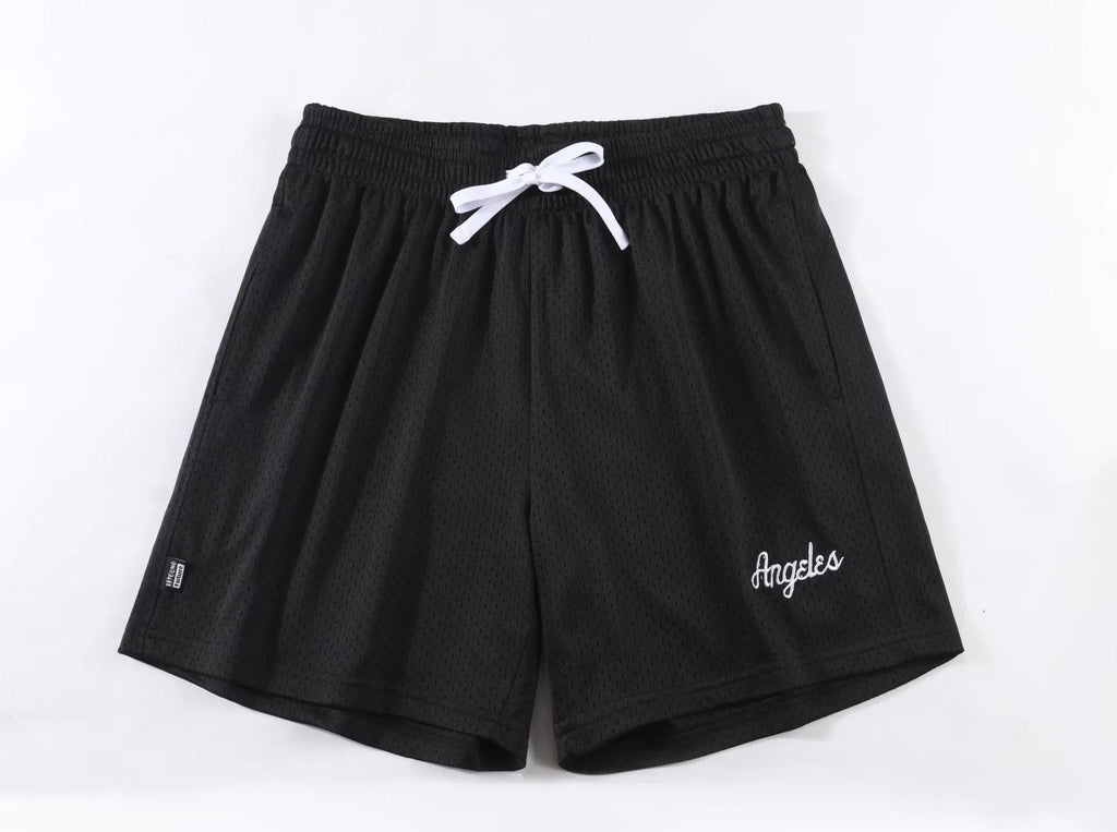 Men's black double-layer mesh sports shorts on a white background.