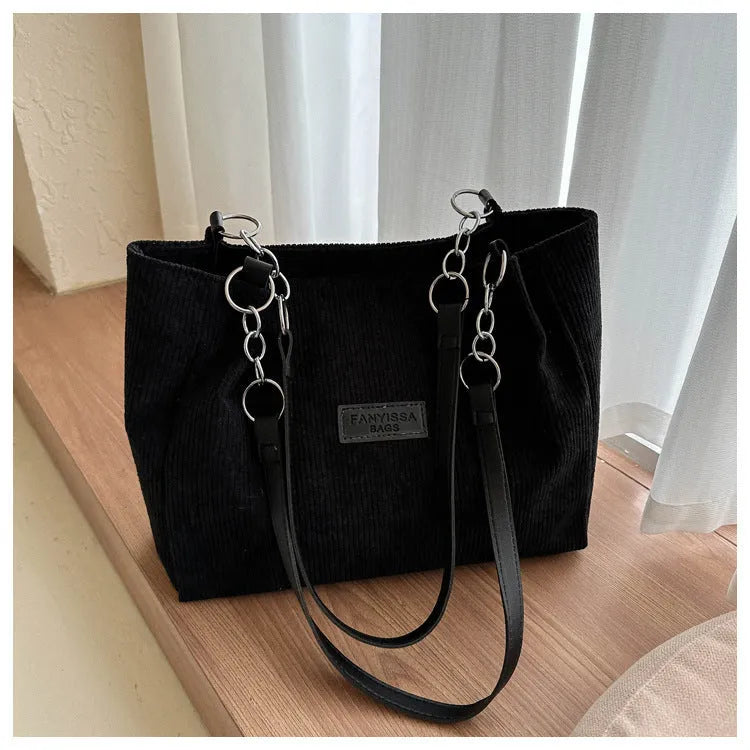 Corduroy one-shoulder tote bag with three-dimensional front pocket in street style design