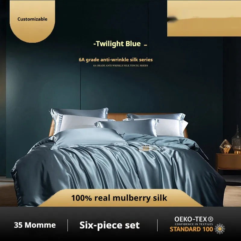 Silk four-piece quilt cover set in solid colour displayed on bed with pillowcases