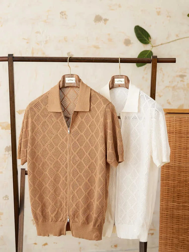 Light brown cotton cardigan top with lapel collar, short sleeves, and a centre front zipper on a hanger.