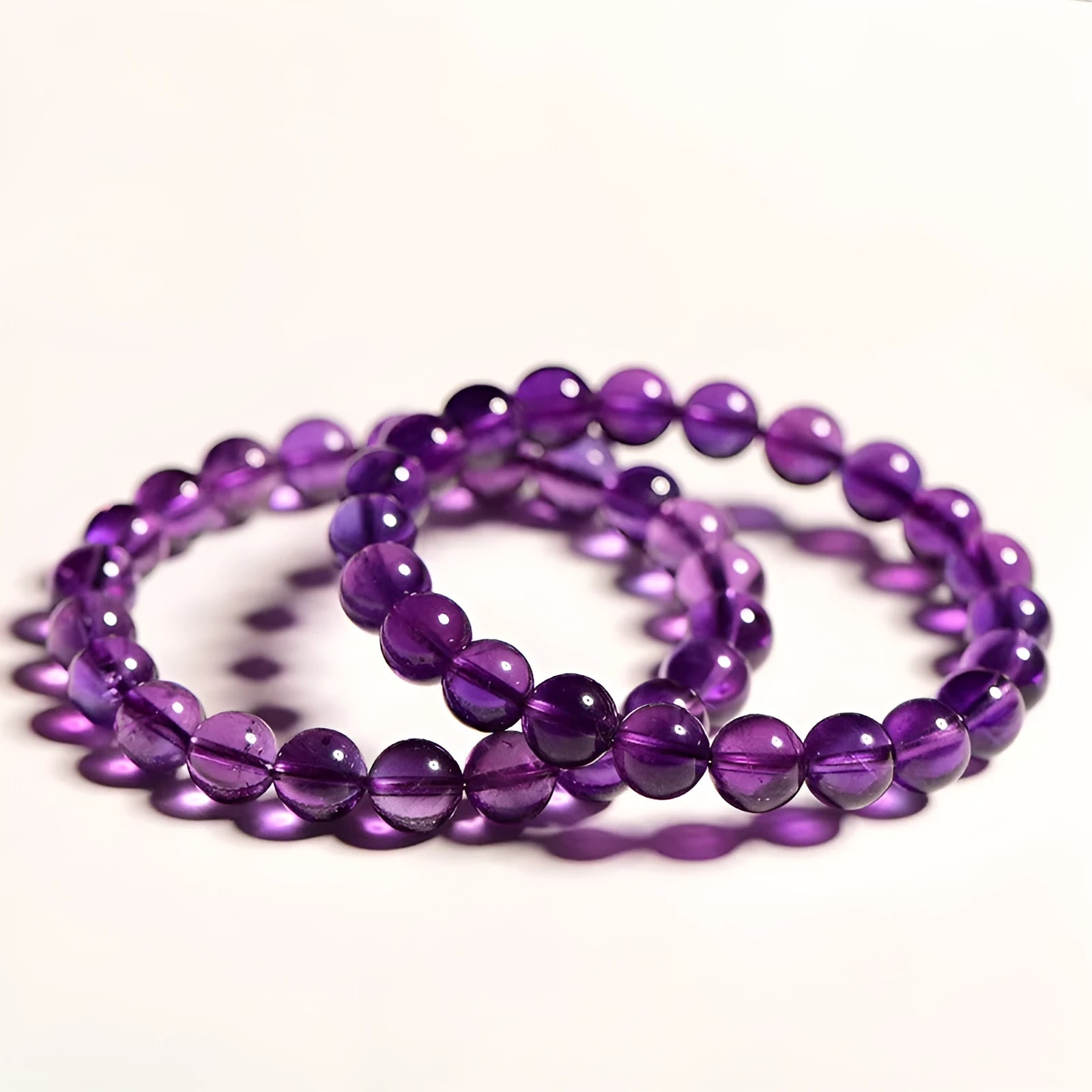 Natural amethyst Uruguay bracelet with scattered polished crystal beads on wrist