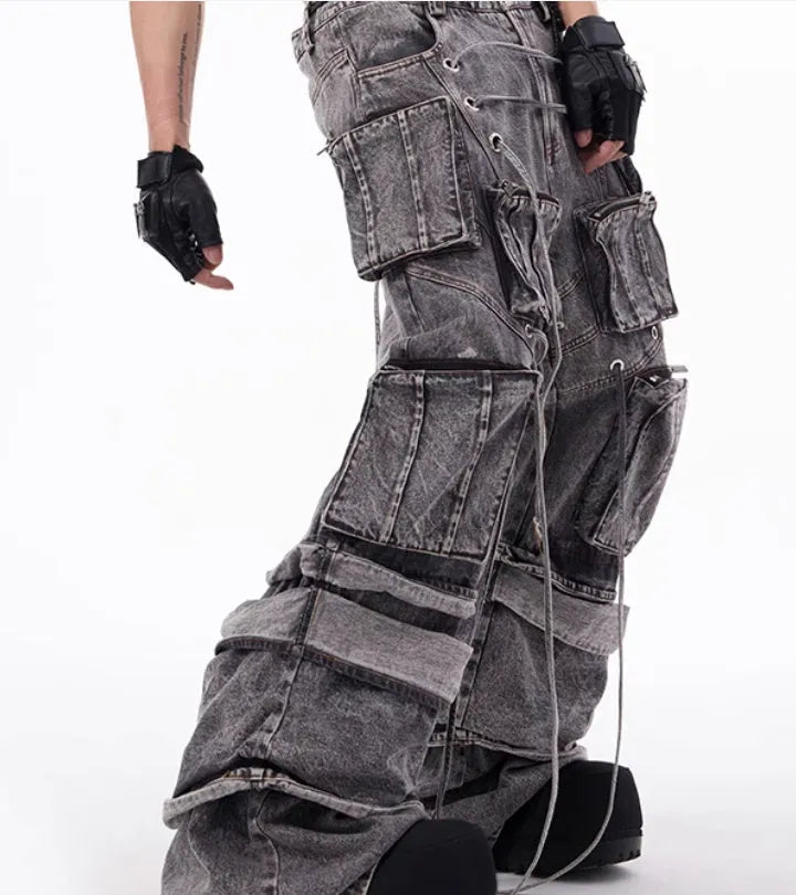 Grey distressed denim overalls with rope stitching detailing in American-style design
