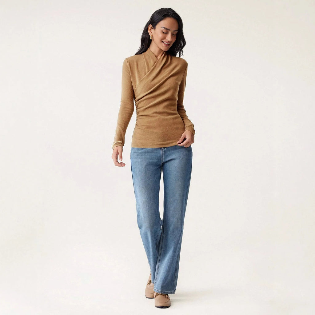 Camel-colour women's slim fit long sleeve pullover sweater on a hanger