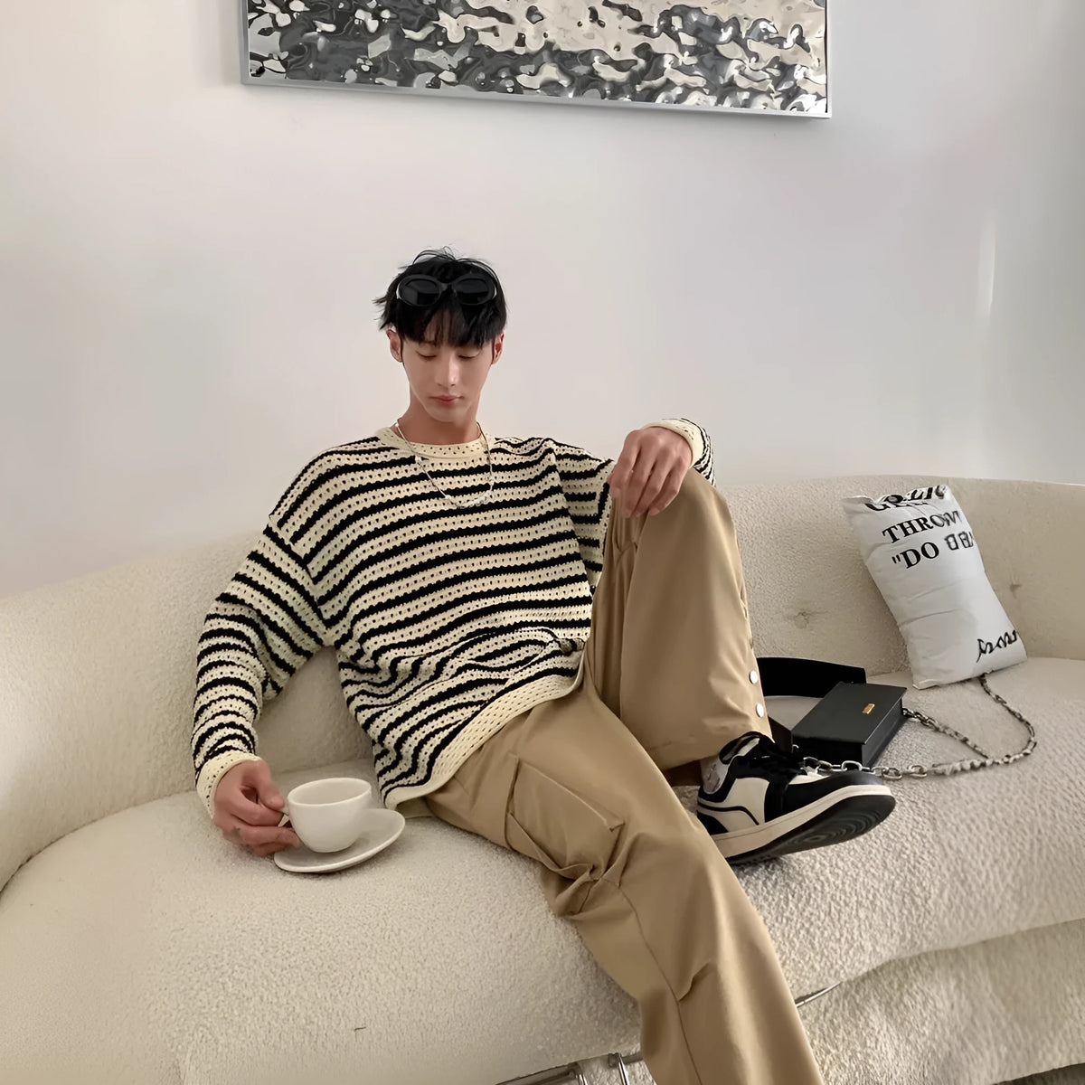 Men's black loose fit long sleeve sweater cotton blend on model front view