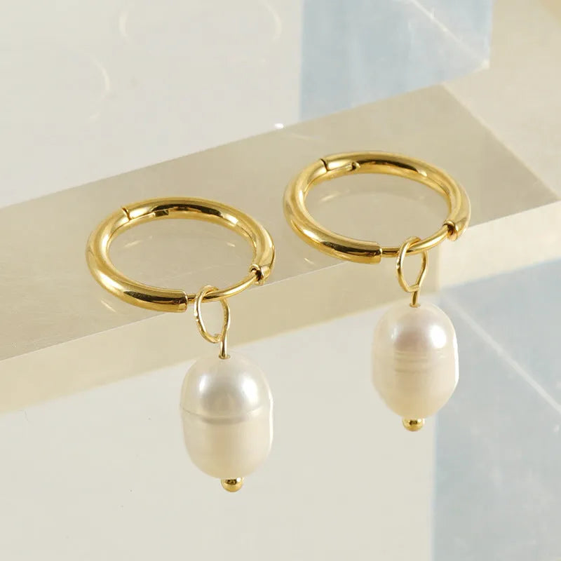 Gold geometric pearl earrings in stainless steel with titanium steel components