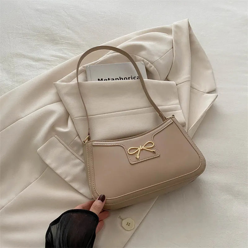 Western style baguette shoulder bag in six colours with 24x14x5cm dimensions and single strap