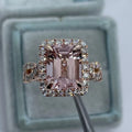 Geometric rose gold alloy ring on a plain background showing its shape and electroplated finish.