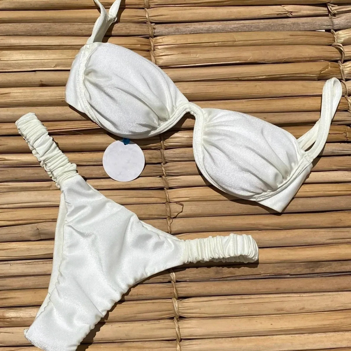 Women's black underwire bikini swimsuit set on a hanger.