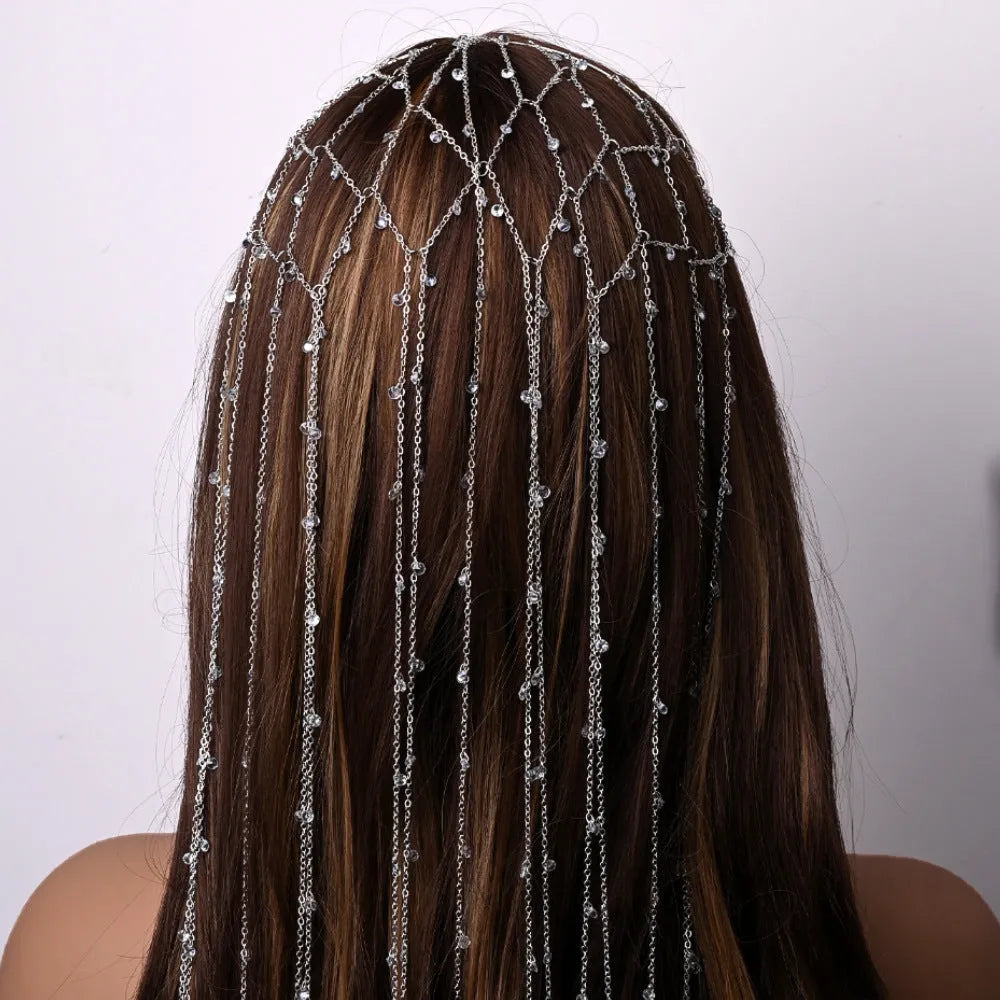 Gold mesh hair band with rhinestone decoration and tassel detail for formal hairstyles