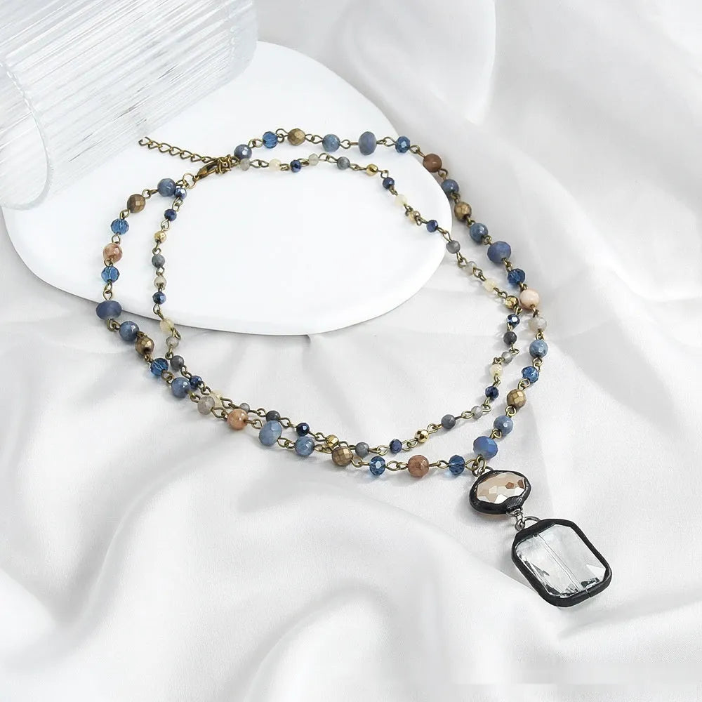 Tribal style necklace with stone and glass pendant on adjustable alloy chain in retro design