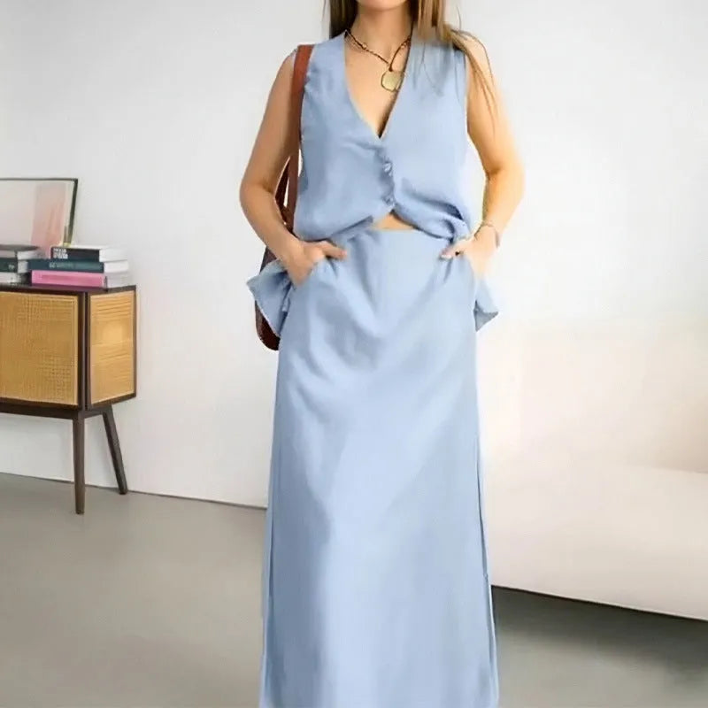 Women's blue polyester sleeveless vest and long skirt two-piece casual outfit set on a hanger.