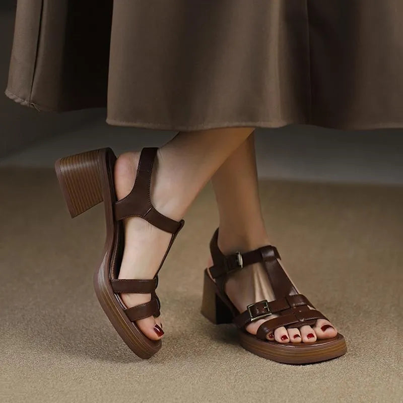 Black women's retro sandals with T-shaped buckle, open toe, chunky platform heel, and square toe shape.
