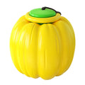 Plastic orange pumpkin-shaped dog chew toy with squeaker for small dogs on a green background.