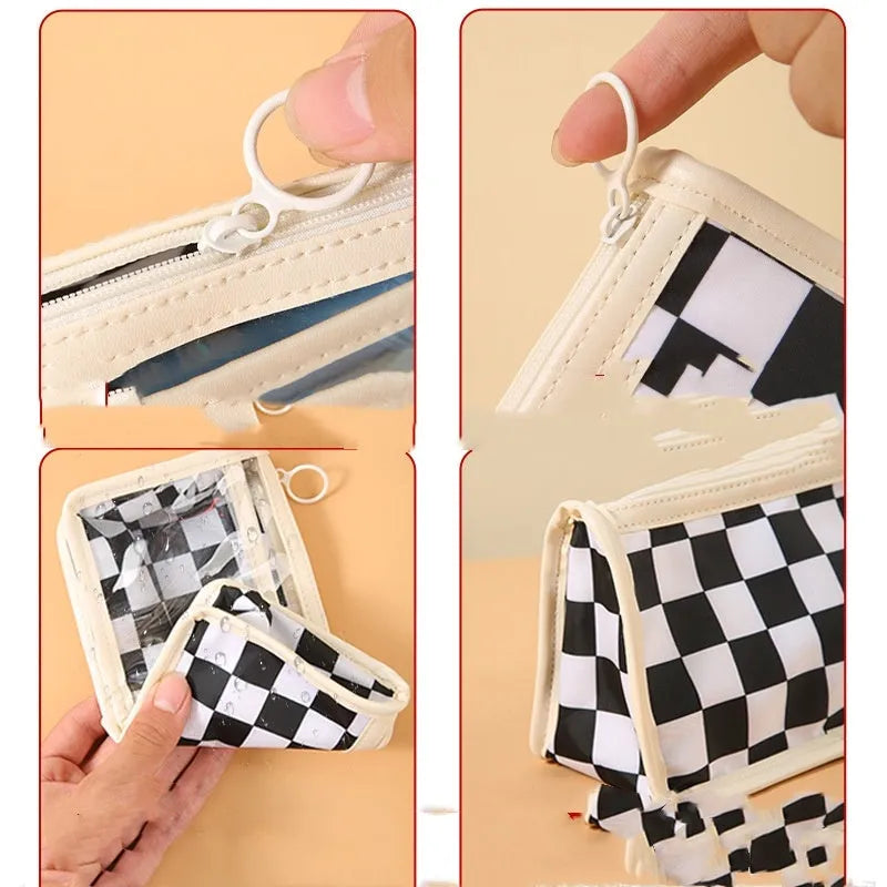 Transparent PVC pencil case with chessboard grid pattern showing pens inside, dimensions 21.5cm x 8cm x 11.5cm
