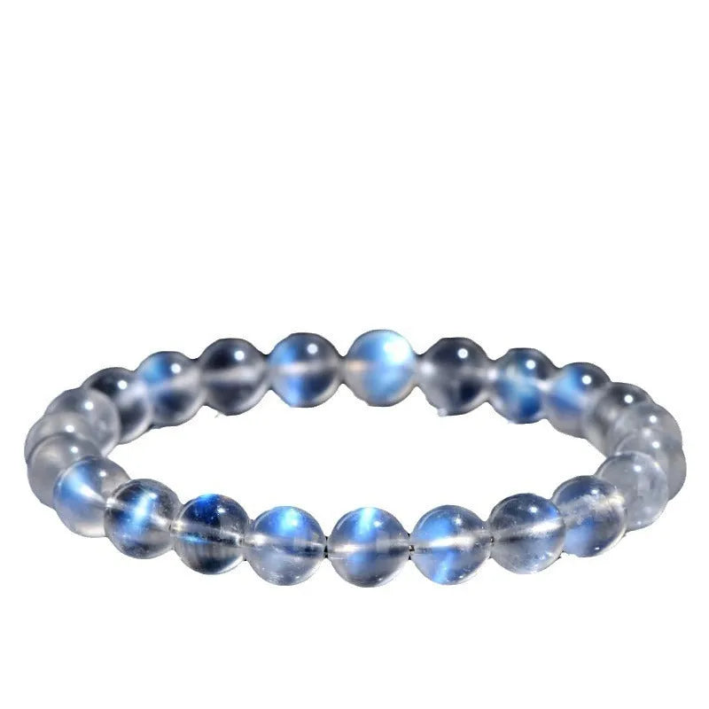 Natural cream body blue moonlight crystal bracelet showing simple design and crystal details.