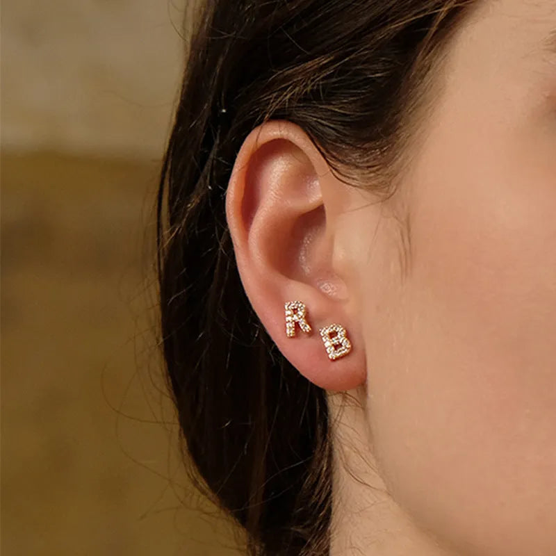 Brass gold plated alphabet letter earrings with zircon detailing showing single letter personalisation
