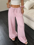Women's black wide leg trousers with lace-up waist detailing on mid-rise waist