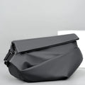 Men's grey medium crossbody bag with shoulder strap showing internal phone and document pockets