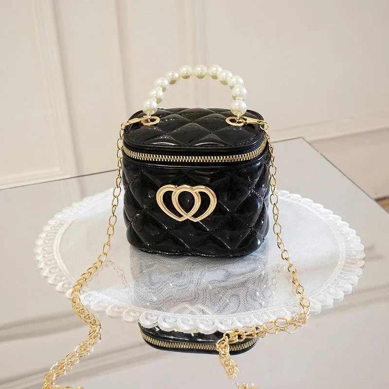 White PVC bucket handbag with a heart-shaped pattern