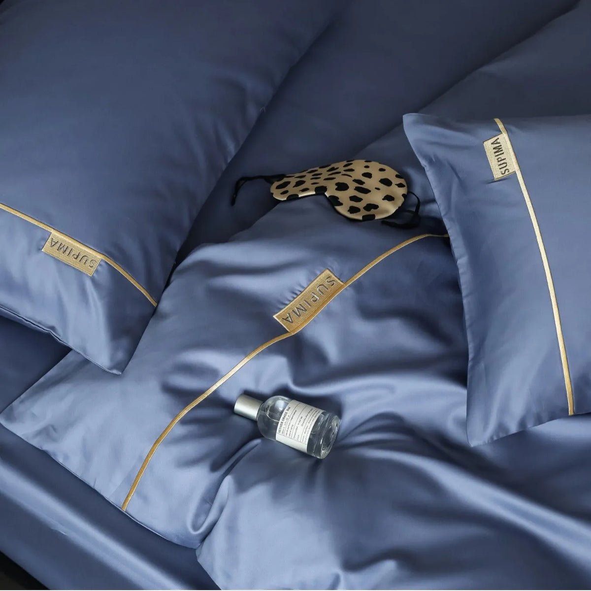 Embroidered pure cotton four-piece bed sheet set with quilt cover, bed sheet and pillowcase in blue, champagne, grey, pink or white.