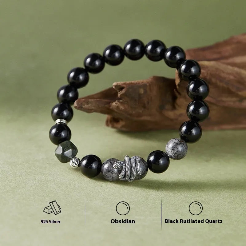 S925 sterling silver snake bracelet with obsidian black hair crystal centrepiece on wrist