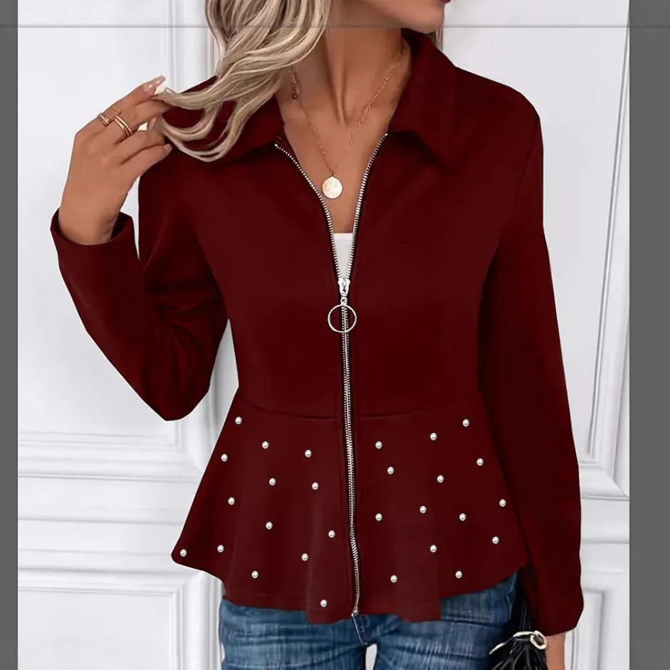 Women's loose fit black coat with beaded heavy-duty zipper and ruffled hem detail.
