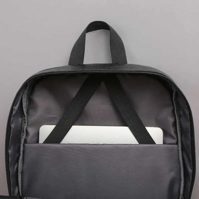Black men's casual backpack with PU outer and polyester lining, waterproof, under 20L capacity