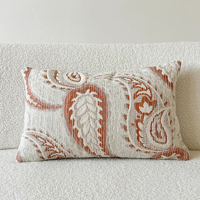 American-style yarn-dyed jacquard pillow cover with paisley pattern in amber colours on sofa