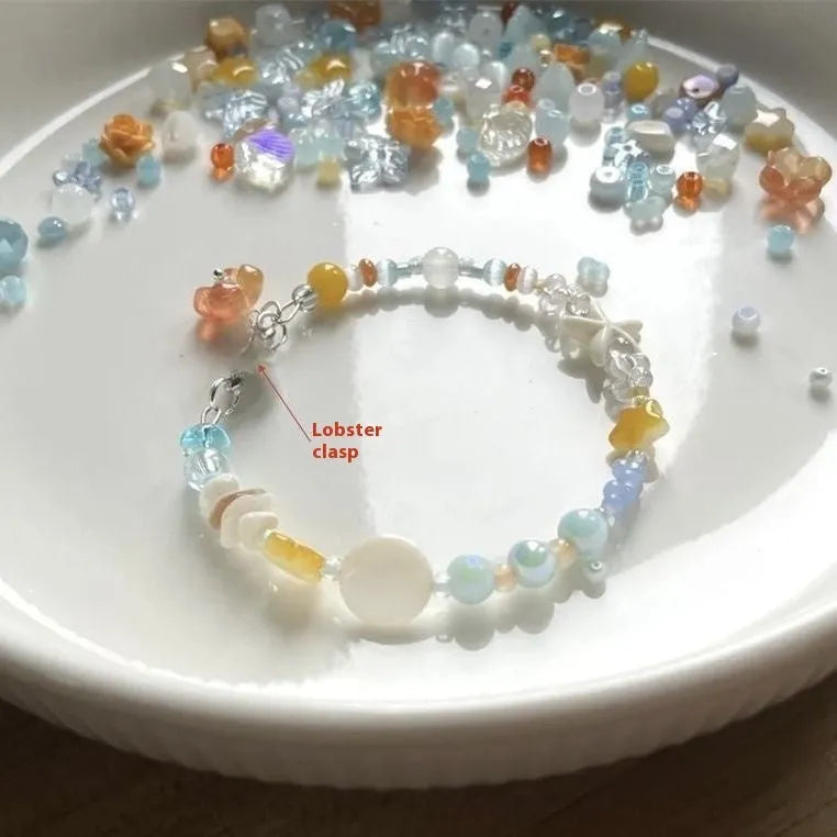Orange alloy bracelet with diamond shape design and mixed materials for summer seaside wear