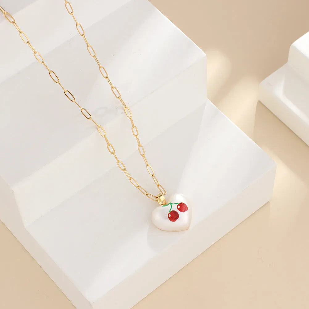 Girl's adjustable necklace with a heart and geometric fruit charms on a chain