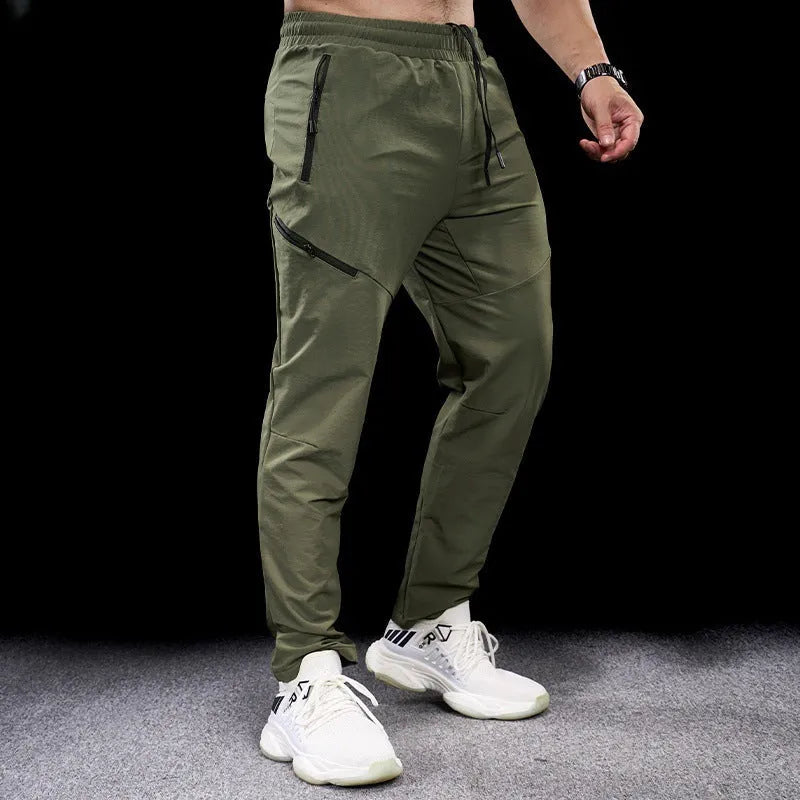 Men's waterproof quick-drying nylon exercise trousers in Army Green colour with mid waist design