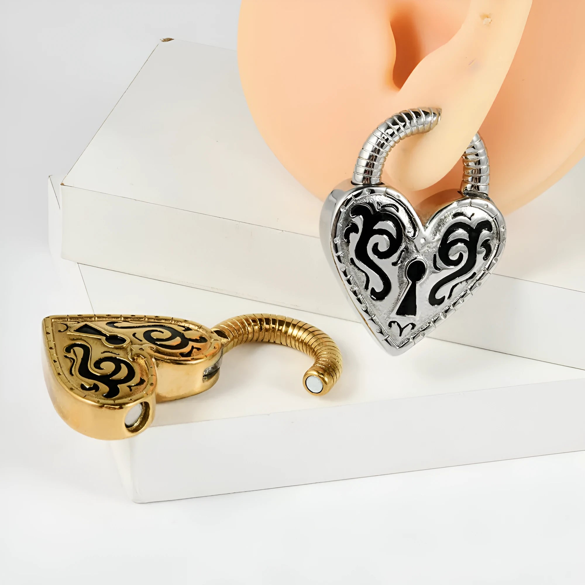 Single stainless steel heart-shaped stud earring for fresh piercings in gold colour.