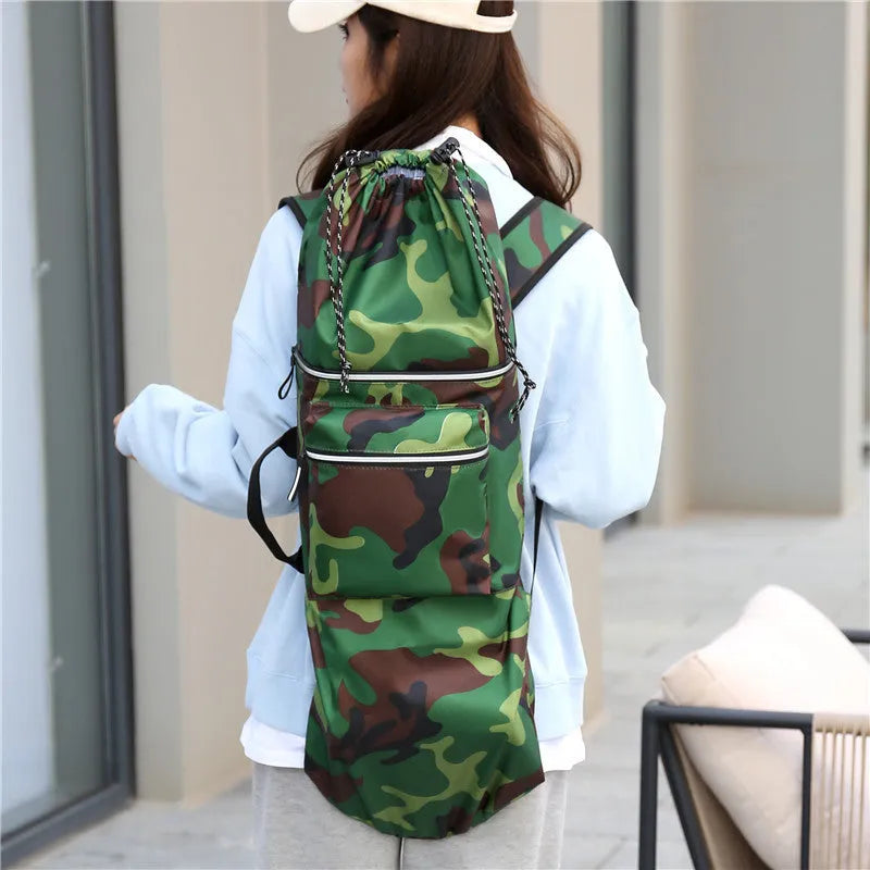 Lightweight waterproof skateboard backpack in black nylon with skateboard storage compartment