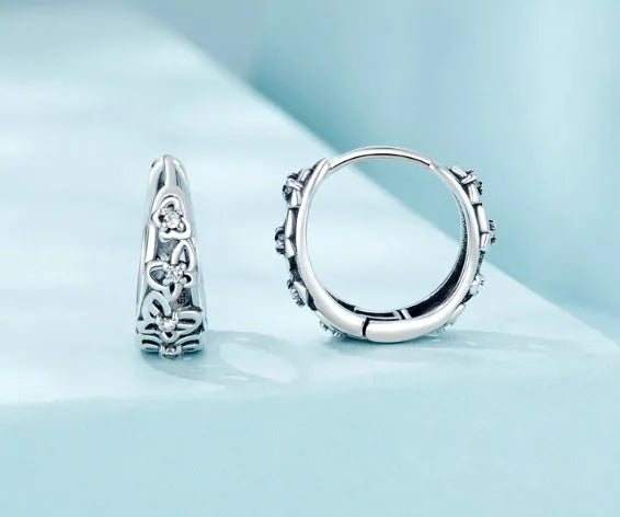 Sterling silver retro hollow butterfly earrings with zircon accents measuring 14mm by 5mm
