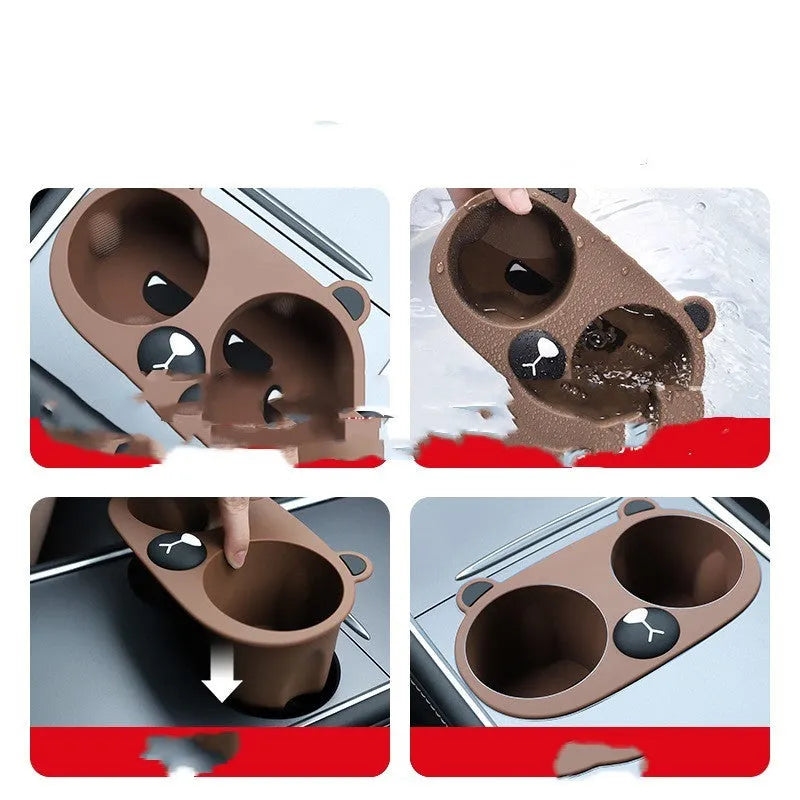 A grey silicone insert designed for a car centre console cup holder.