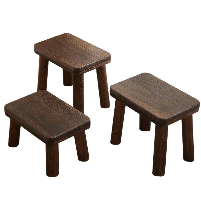 Distressed finish wooden shoes changing stool with bracket construction legs.