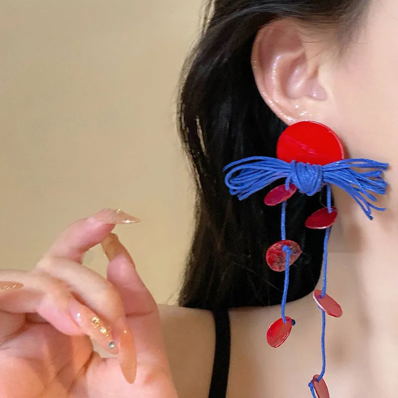 Geometric cloth earrings with blue resin flower and silver needle colour details