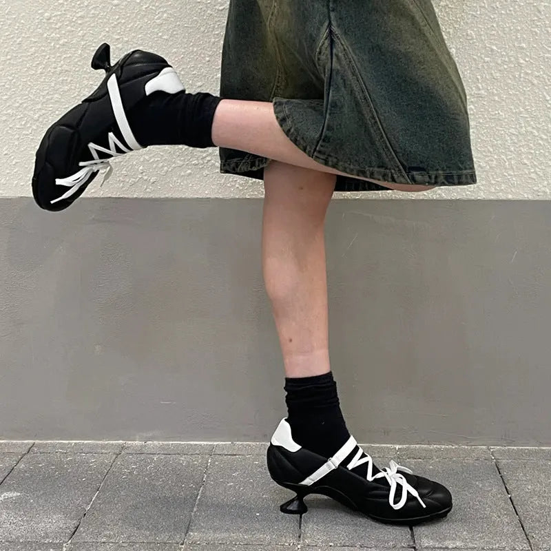 Women's silver lace-up bow sports shoes with a round toe and mid heel on a white background
