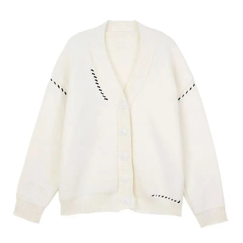 Women's loose fit knitted cardigan top coat in black or white colour with long sleeves.