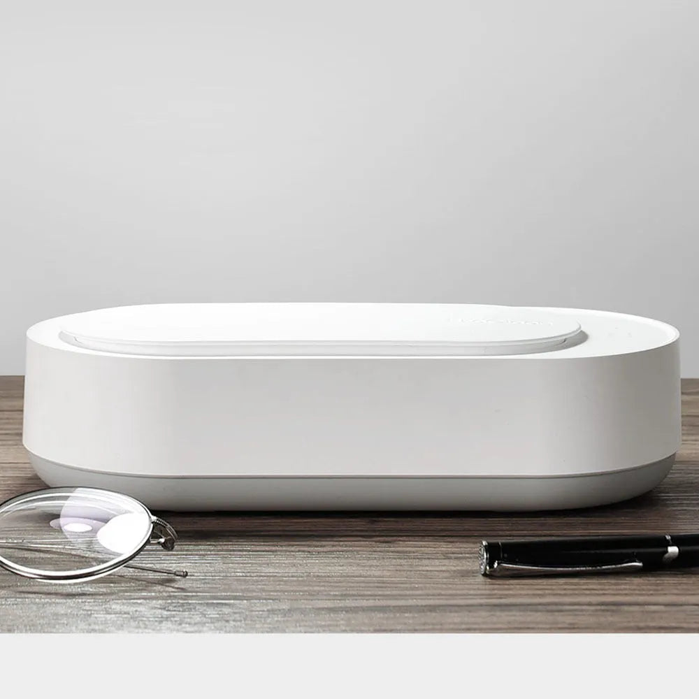 White portable ultrasonic cleaning machine with display and stainless steel tank.