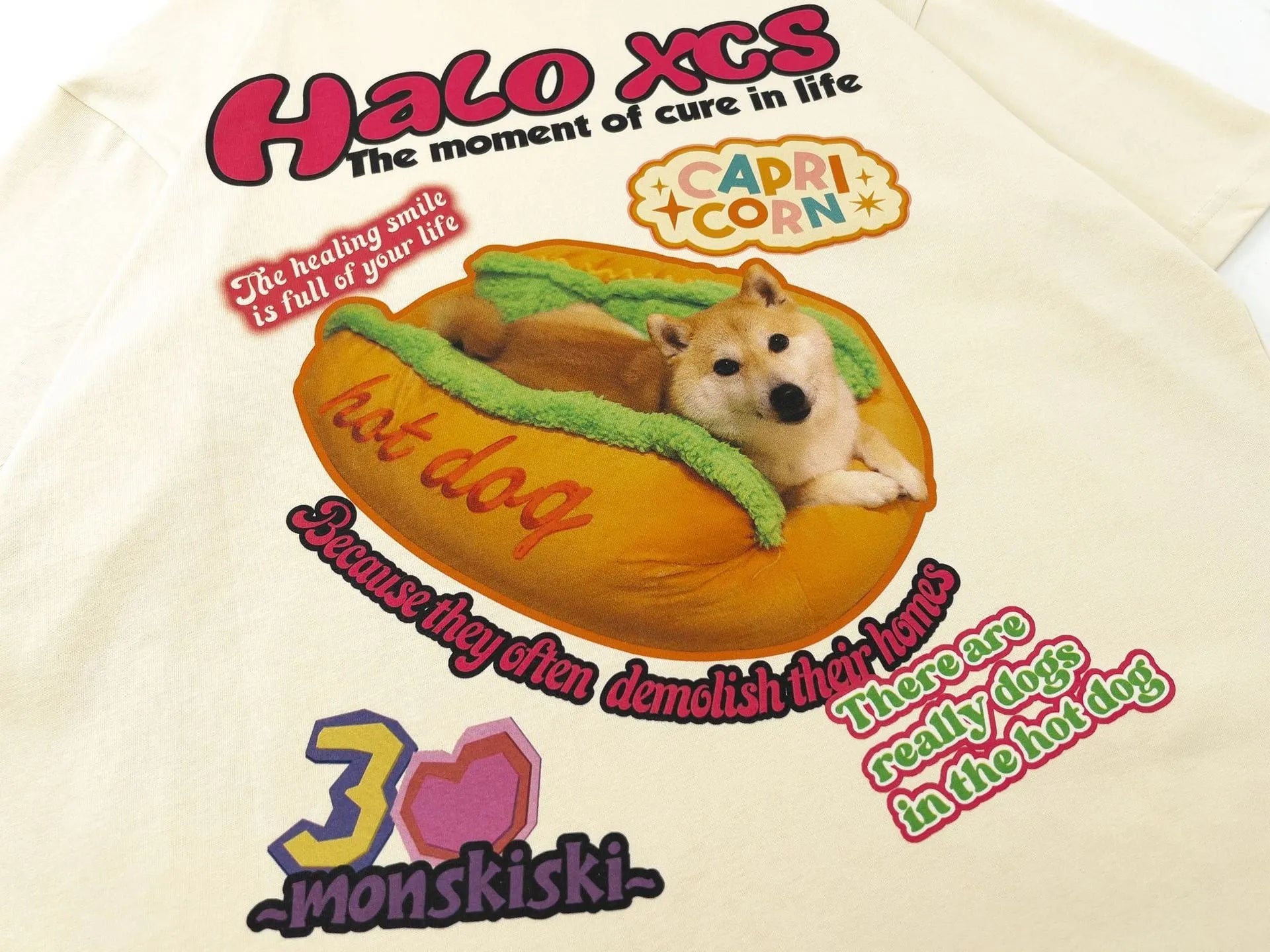 Cartoon hamburger dog printed cotton T-shirt in loose fit, shown in white colour.