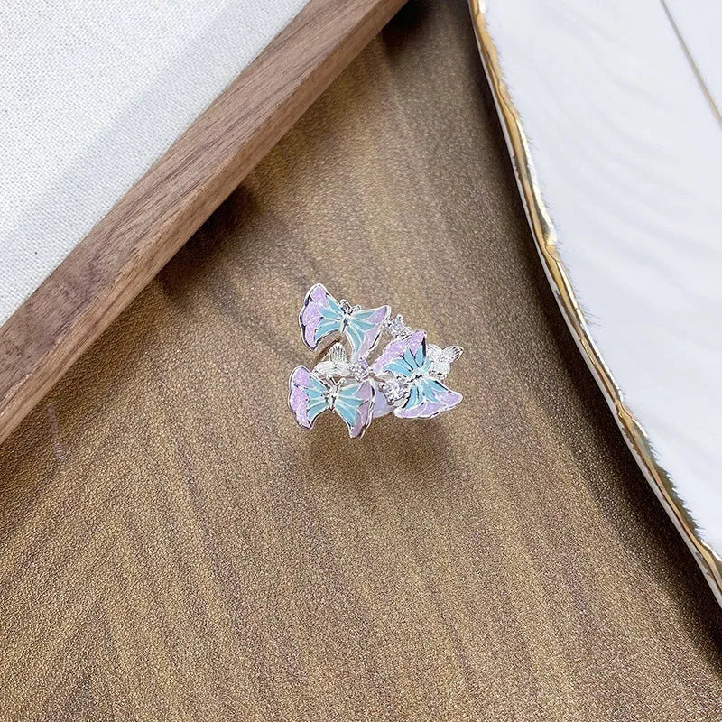 Adjustable copper insect ring with dripping oil colour finish in an irregular design.