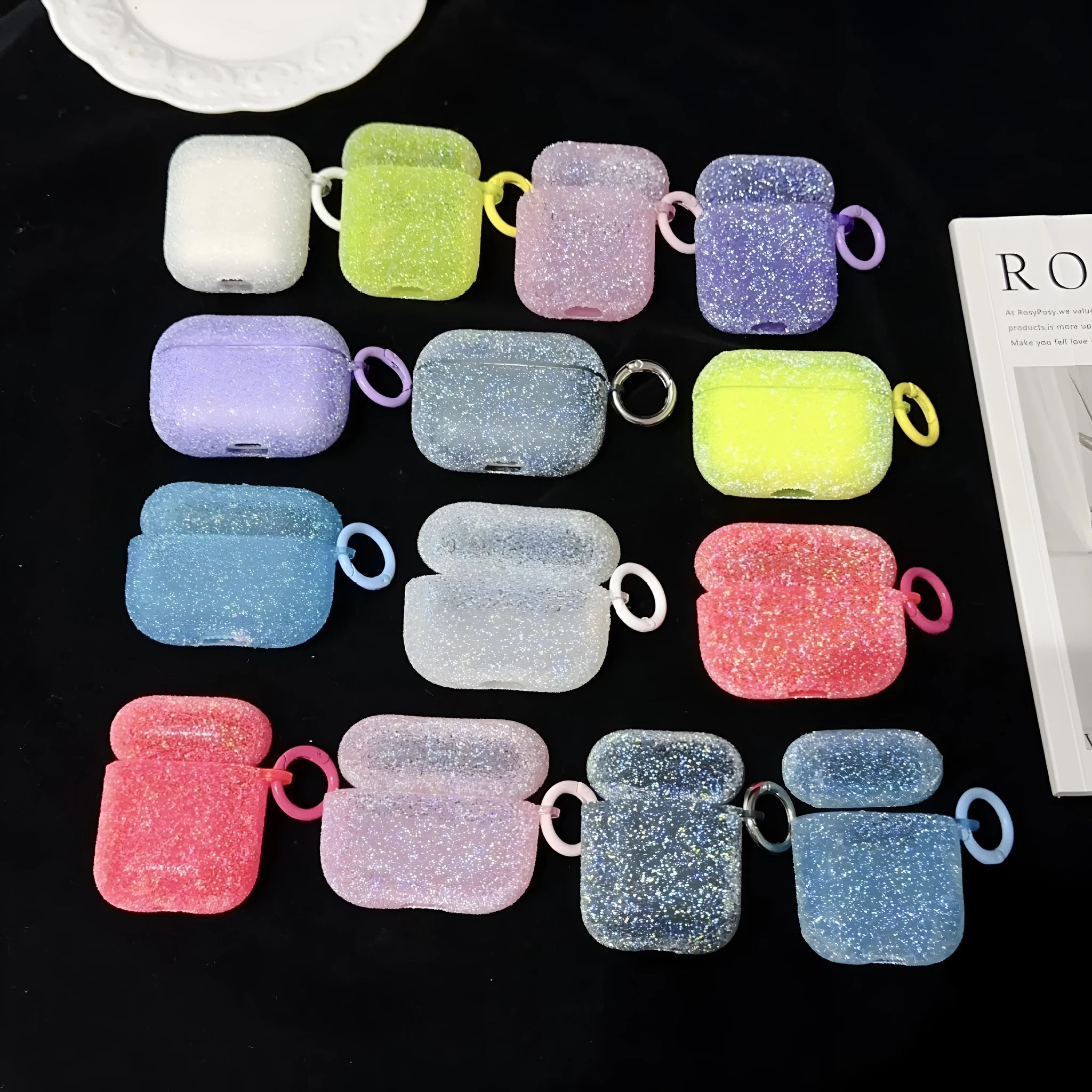 Handmade rhinestone crystal TPU protective cover for AirPods in pink, showing textured surface
