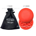 Orange golf training mat with centre of gravity design on natural rubber surface