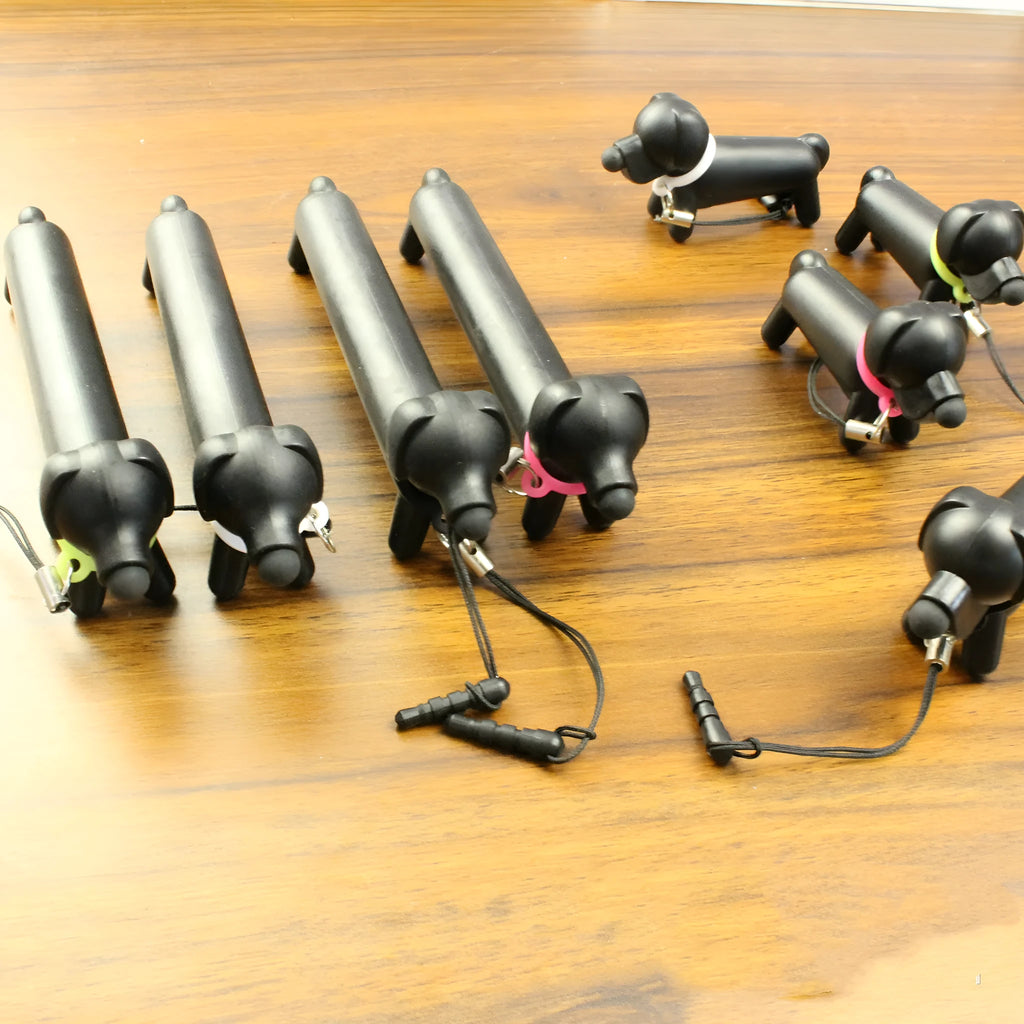 Black puppy-shaped touch screen stylus pen shown in dual-length positions with phone holder function