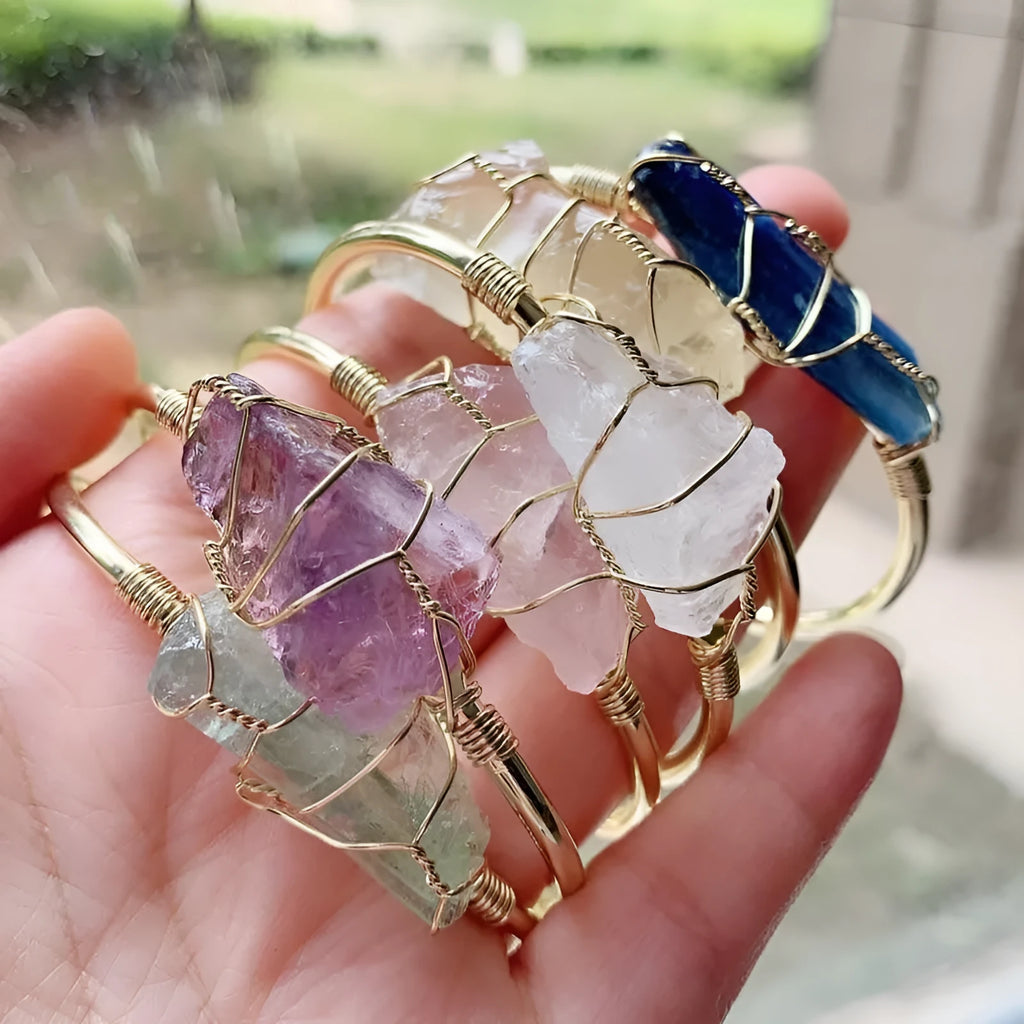 Geometric gold wire bracelet with unshaped natural rough stone crystals in bohemian style.