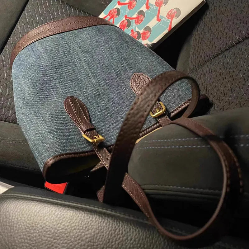 Large denim patchwork retro bucket handbag with a one-shoulder strap.