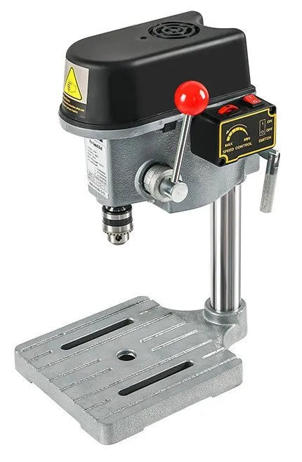 Bench drilling and milling machine with cross bench pliers and heavy duty bench pliers on a workshop table
